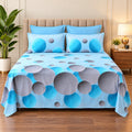Whimsy Weave Aqua Bubble Print Bedsheet Set on a bed
