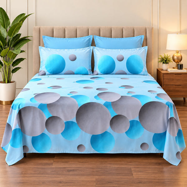 Whimsy Weave Aqua Bubble Print Bedsheet Set on a bed