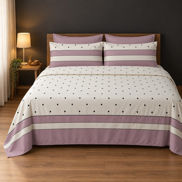 Whimsy Weave Mauve Polka Dot Print Bedsheet Set on a bed