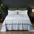 Whimsy Weave Sage Stripe Print Bedsheet Set on a bed